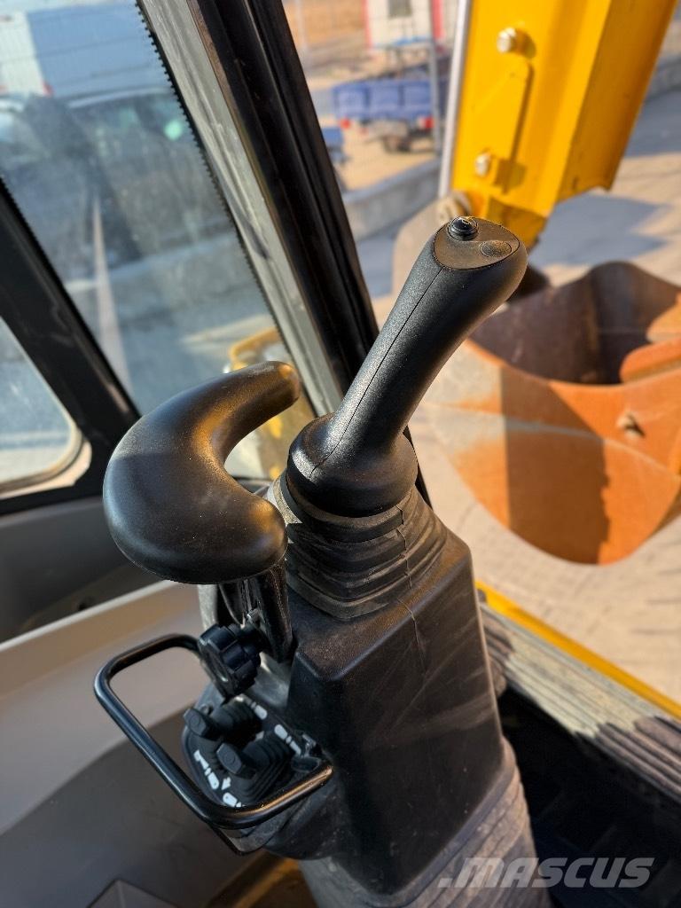 New Holland B 115 Retrocargadoras