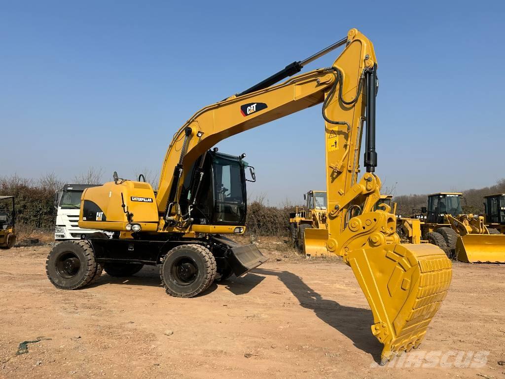 CAT M 320D Excavadoras de ruedas
