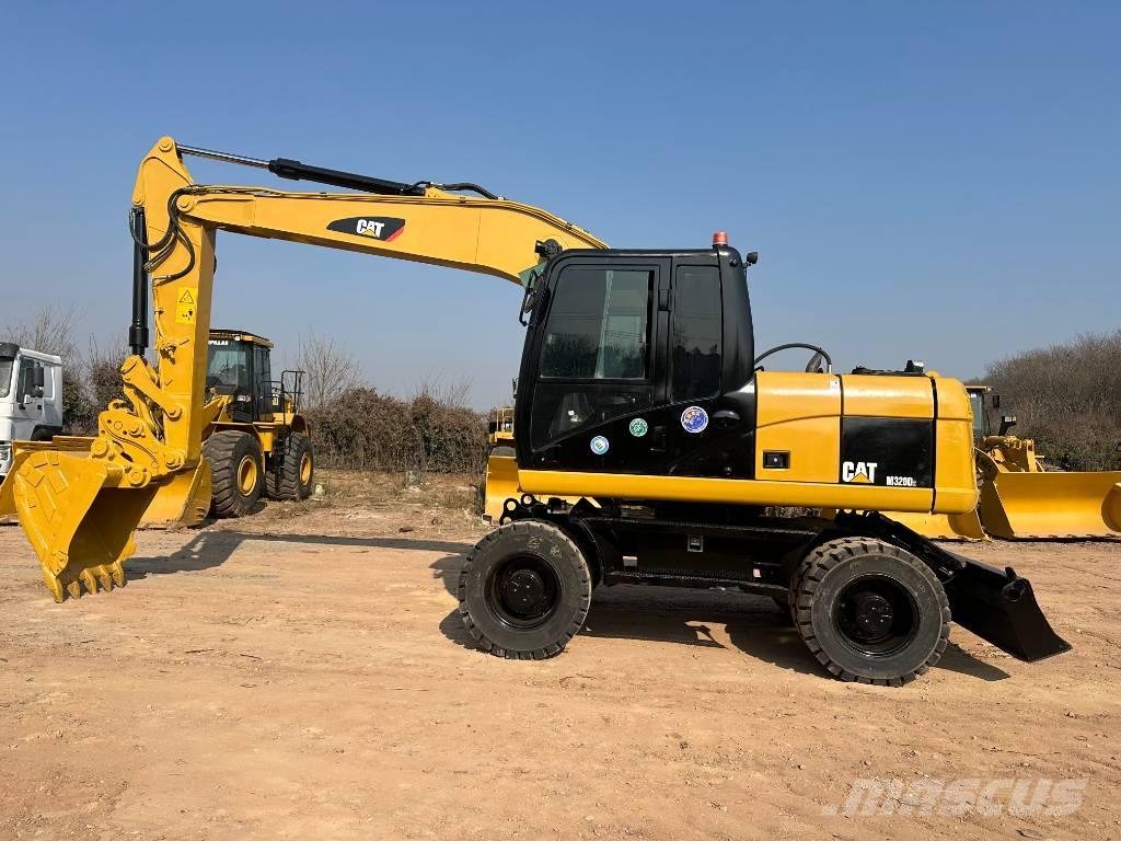 CAT M 320D Excavadoras de ruedas