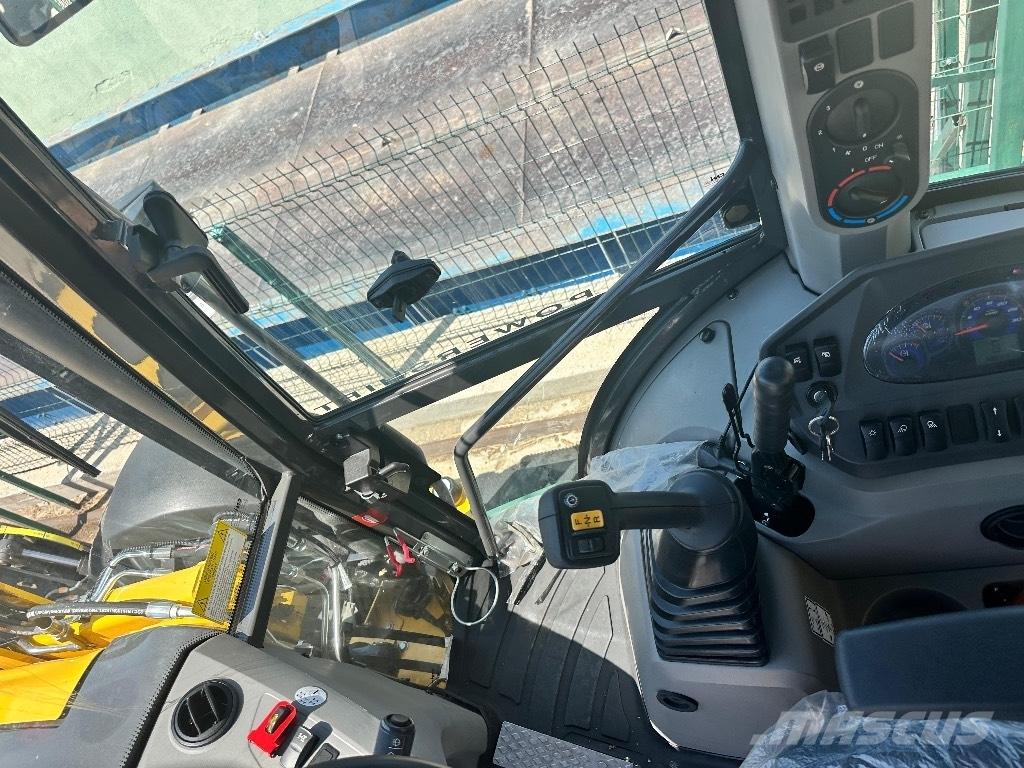 New Holland B 115 B Retrocargadoras